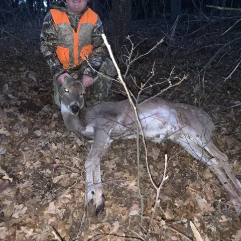 boy with harvested buck