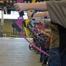 Student archers shooting bows for National Archery in the Schools Program.