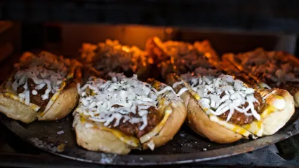 A photo of an elk Italian sandwich in the oven.