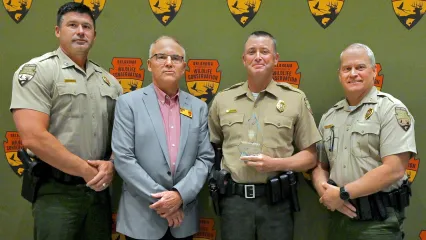From left, Lt. Col. Wade Farrar, Assistant Chief of Law Enforcement; ODWC Director Wade Free; deMontigny; and Law Enforcement Chief Col. Nathan Erdman.