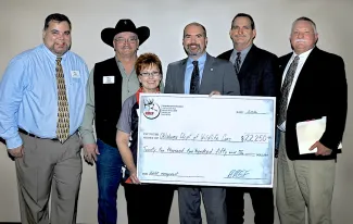 Gathered to present a $22,250 donation from the Rocky Mountain Elk Foundation are, from left, RMEF Regional Director Shane Stenquist, RMEF Regional Chairman Jeff Steele, RMEF State Chairwoman Gayle Steele, Wildlife Department Director J.D. Strong, Assistant Chief of Wildlife Bill Dinkines and Chief of Wildlife Alan Peoples. (DON P. BROWN / ODWC)