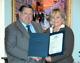 Wildlife Conservation Commissioner John  D. Groendyke of Enid accepts a citation from Oklahoma Gov. Mary Fallin recognizing his 40 years of service on the Oklahoma Wildlife Conservation Commission. (DON P. BROWN / ODWC)