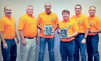 Gathered for presentation of the Wildlife Division's Biologist and Technician of the Year honors are, from left, Wildlife Department Director J.D. Strong, Wildlife Chief Alan Peoples, Biologist of the Year Chris Parker, Technician of the Year Ira Woods, Wildlife Assistant Chief Bill Dinkines and Department Assistant Director Wade Free. (DON P. BROWN/ODWC)