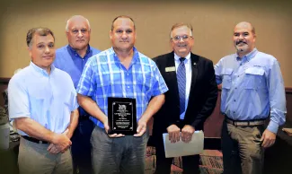 Gathered for the NWTF Officer of the Year award are, from left, Bill Hale, Chief of Law Enforcement for the Wildlife Department; Terry Bourne, NWTF LIttle Dixie Chapter president; honoree Game Warden Jay Harvey; Don Chitwood, NWTF Eastern Oklahoma regional director; and Wildife Department Director J.D. Strong. (Don P. Brown/ODWC)