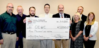 The Central Oklahoma 89er Quail Forever chapter donates $5,000 to the Stars &amp; Stripes Project. From left, Troy Ellefson, Jerry Huffstutlar, John Bellah, James Dietsch, ODWC Director J.D. Strong, ODWC Assistant Director Melinda Streich, ODWC Assistant Director Wade Free, and ODWC legislative liaison Corey Jager.