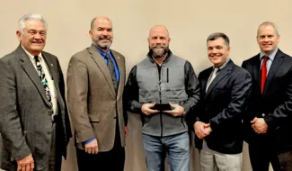 Landowner Toby Thomas (center) honored for his airboat donation, surrounded by ODWC staff and Wildlife Commissioner Bill Brewster.