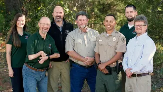 Agency employees in group photo.