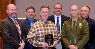 2019 Landowner Conservationist of the Year Award: J.D. Strong, Director-ODWC; Russ Horton, Research Supervisor; Gerald Choate, honoree; Bill Dinkines, Assistant Chief-Wildlife; Carlos Gomez, Game Warden; Wade Free, Assistant Director-ODWC.