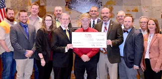 Gathered for presentation of a $124,479 donation from the Oklahoma chapter of National Wild Turkey Federation are, from left, Garrett McClendon, Jared McJunkin, Jeff Springman, NWTF State President Kamara Gatz, Jared Cullison, O.D. Curry, Earl Gilbert, Assistant Chief of Wildlife Bill Dinkines, ODWC Director J.D. Strong, Don Chitwood, T.J. Goodpasture, Rick Nolan and Leah Lowe. (Don P. Brown/ODWC)