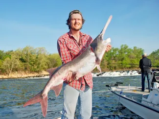 Country music star Blake Shelton, seen in this file photo with his lake-record paddlefish, will serve on the board of directors of the new Oklahoma Wildlife Conservation Foundation. (Nels Rodefeld/ODWC)