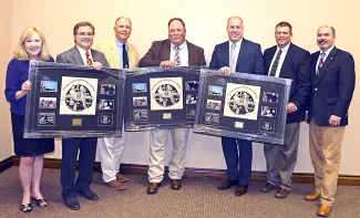 Partners for Fish and Wildlife Program of the U.S. Fish and Wildlife Service was recognized for supporting Outdoor Education. From left are Jonna Polk, Don Wilhelm, Terry Dupree, John Hendrix, Matt Filsinger, ODWC Education Supervisor Colin Berg, and ODWC Director J.D. Strong. (Don P. Brown/ODWC)