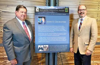 Commissioner John D. Groendyke and Director J. D. Strong