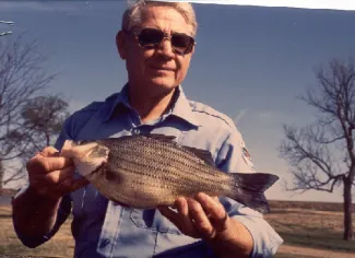 George R. Edwards holding state record Hybrid Yellow Bass.