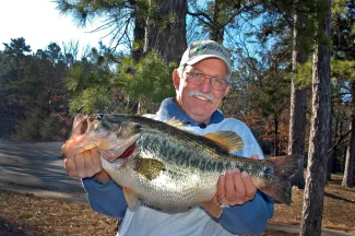 Dale Miller holding state record largemouth bass.