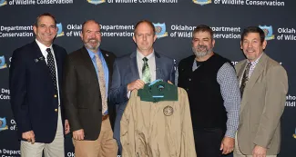 Gathered for a special recognition of service from the Central Flyway Council are, from left, Wildlife Chief Bill Dinkines, ODWC Director J.D. Strong, Wildlife-Private Lands Supervisor Josh Richardson (honoree), Programs Supervisor Jerry Shaw, and Wildlife Assistant Chief Russ Horton. (Don P. Brown/ODWC)