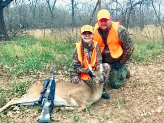 Natalee and Larry Heck with harvested deer.