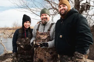 Duck hunters out in the field with harvest.  Photo by Sarah Southerland