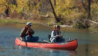Man and woman in canoe.