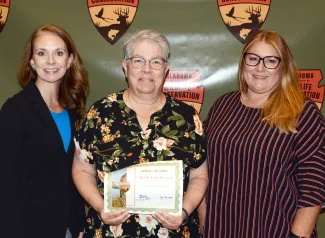 Gathered for presentation of the Spirit of ODWC Award are Chief of Administration and CFO Amanda Storck, recipient Cheryl Luetkemeyer (Chief Procurement Officer), and Accounting Supervisor Lindsey Presley.