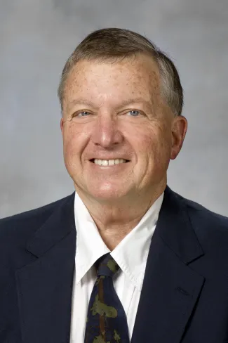 A portrait of William Caire