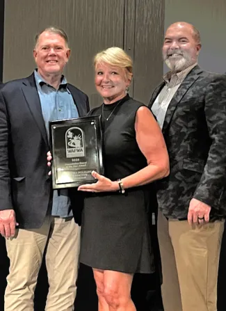 Barwick and Gaddis and Strong accept WAFWA award