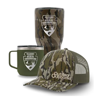 A set of ODWC merchandise including a hat, a mug, and a tumbler.