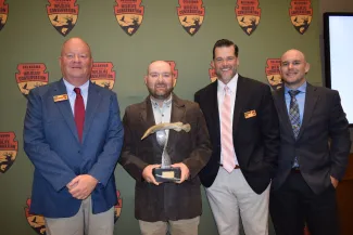 Fisheries Chief Kenneth Cunningham, left, Fisheries Biologist Michael Hollie, Fisheries Assistant Chief Richard Snow, Fisheries Regional Supervisor Douglas Zentner.