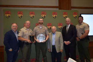 Shikar-Safari Club International Club Member Raegen Siegfried, Law Enforcement Chief Nathan Erdman, Game Warden Justin Cornett, Shikar-Safari Club International Club Members Robin Siegfried and James Johnson, Law Enforcement Assistant Chief Wade Farrar.