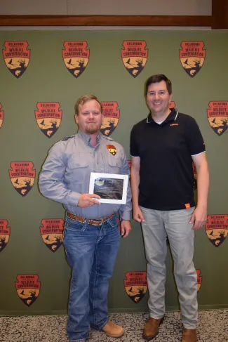 enior Wildlife Biologist Marcus Thibodeau, left, and OKTWS President Colter Chitwood.