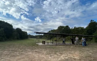 ODWC employees are seen within an old covered shooting area.