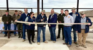 ribbon cutting at Optima shooting range