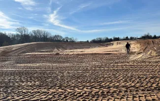 A photo of the construction progress of the Canton WMA shooting range. Dirt work is making progress, all vegetation is cleared and the berms are taking shape.