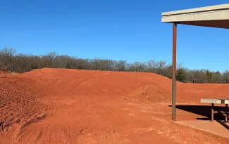 A photo of the construction progress of the Lexingotn WMA shooting range. Dirt work is making progress, all vegetation is cleared and the berms are taking shape.