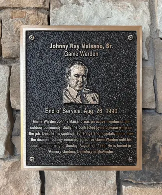 A plaque honoring Johhny Ray.