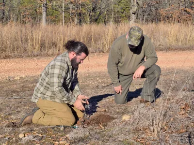 two men setting a trap