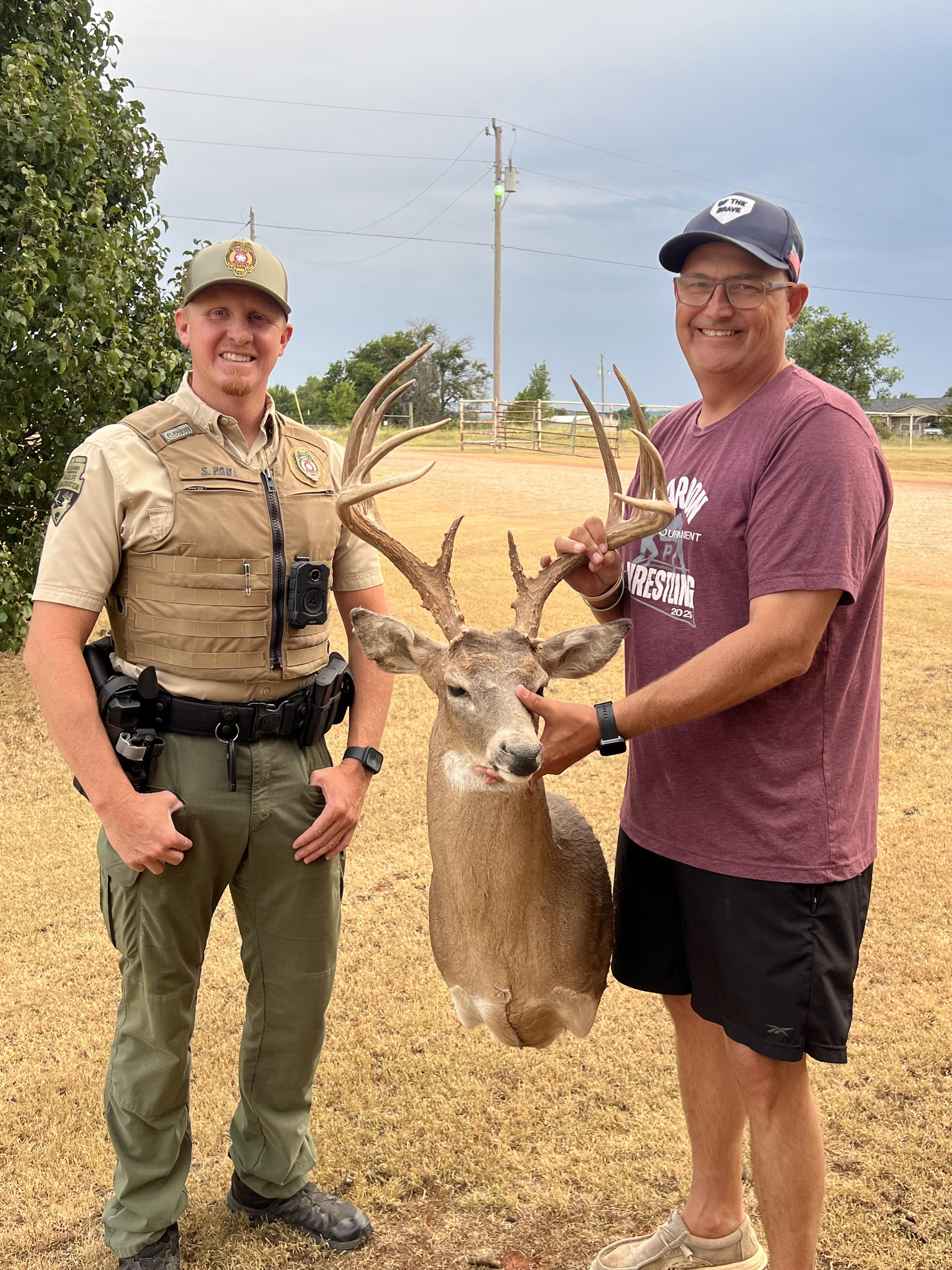 Jeff Kukuk holding his whitetail deer mount